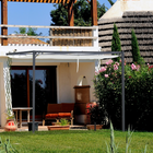 Outsunny 10 ft W x 10 ft L Outdoor Pergola Gazebo with Retractable Canopy - Cream White-Top canopy slides: have it pushed back or fully closed