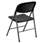Flash Furniture HERCULES Black Plastic Folding Chair with Charcoal Frame-Lightweight design for easy transport and storage