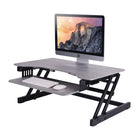 Rocelco 32" Sit-To-Stand Adjustable Height Desk Riser with Easy-Lift Handles - Grey-Sleek black metal finish and black wooden shelves complement any office decor