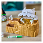 Crayola Scribble Scrubbie Dino Glow Mountain Playset-Includes 4 Baby Glow Dino Pets, 3 Markers, 1 Brush, and 1 Battery‑Powered Mountain with lights and a catapult.