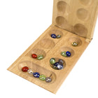 Pressman Mancala Game (PRE442606)-Solid wood game board is hinged so it folds in half and locks into place