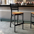 Flash Furniture HERCULES Series Black Ladder Back Metal Restaurant Barstool - Natural Wood Seat-500 lb. Weight Capacity