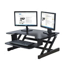 Rocelco ADR Adjustable Height Desk Riser & Indo Board Original Standing Desk Bundle, Black-The Rocelco ADR is made of a combination of metal with wood surfaces. The Indo Board desk is made of solid wood, with a textured finish for a comfortable stance.