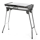 InnovaGoods ExelQ Stainless Steel Foldable Charcoal BBQ-Its folding and portable designmakes it convenient to take anywhere with you, folding into a case and taking up the minimum amount of space. This complete and practicalcharcoal barbecuehas side 2 shelves/trays that can be placed in a vertical position to block the wind, or in a horizontal position for holding food, drinks, condiments, kitchen utensils, etc. The fixedcarry handle makes it easy to carry and can also be used for hanging cloths, aprons, et