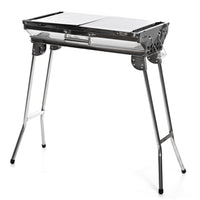 InnovaGoods ExelQ Stainless Steel Foldable Charcoal BBQ-Its folding and portable designmakes it convenient to take anywhere with you, folding into a case and taking up the minimum amount of space. This complete and practicalcharcoal barbecuehas side 2 shelves/trays that can be placed in a vertical position to block the wind, or in a horizontal position for holding food, drinks, condiments, kitchen utensils, etc. The fixedcarry handle makes it easy to carry and can also be used for hanging cloths, aprons, et