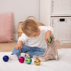 TickiT Sensory Reflective Color Mystery Balls - Set of 6-The set features 6 colors: silver, gold, pink, blue, green and purple. And each ball has different contents, which change their characteristics when rolled or shaken