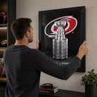 Frameworth Carolina Hurricanes 16" H x 20" W Frame 2026 Stanley Cup Champions Framed Wall Art 16" x 20" W Frameworth - Officially Licensed NHL/NHLPA-Product-type accurate build: Clear protective front helps preserve the printed display while keeping the framed artwork ready for everyday wall display