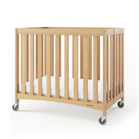 Foundations Travel Sleeper Compact Folding Crib w/ Oversized Casters - 40" x 26" x 34"-Requires simple assembly