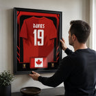 Frameworth Official FIFA World Cup 2026 Canada Alphonso Davies Framed Replica Jersey - 25.75" x 33.75"-Handcrafted in Canada by Frameworth Sports Marketing, established 1992, producing officially licensed sports memorabilia.