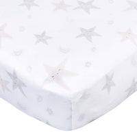 Gerber Childrenswear Knit Crib Sheet - Celestial - Stars-Crafted from a durable blend of polyester and stretchy spandex jersey, this sheet ensures a snug fit on standard crib mattresses, measuring 52 x 28