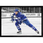 Auston Matthews Toronto Maple Leafs Hustling Spotlight - Framed Canvas - 31" x 22"-Premium canvas print with gallery-wrapped edges