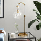 Hudson&Canal Verona 27" Tall Arc Table Lamp with Glass Shade - Brushed Brass/Clear-Handcrafted brushed brass finish is applied to the geometric metal base