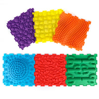 Kore Design Locking Sensory Tactile Tiles - Assorted Colors - 11.8" x 11.8" x 0.6" - Set of 6-Assorted vibrant colors and diverse raised designs: A set of 6sensory tactile mats in assorted colors that can be interconnected. The vibrant colors and diverse raised designs make them well-suited for children to engage in exploration and embrace external stimuli