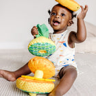 Melissa & Doug Multi-Sensory Pineapple Soft Stacker Infant Toy-5-piece infant toy includes a cloth-covered base and post with rattle, 2 squeezable rings (1 that crinkles), a plastic textured ring, and textured topper with crinkle leaves and fabric ribbons