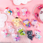 Excell Brands Hello Kitty Cutie Cuffs Blind Box-Made from ultra-soft fabric, Cutie Cuffs are designed to be worn on the wrist or clipped onto backpacks, water bottles, or other items for a touch of cuteness