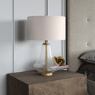 Hudson&Canal Lagos 23" Tall Table Lamp with Fabric Shade - Seeded Glass/Brushed Brass/White-Handcrafted seeded glass and brushed brass finish is applied to the novelty metal and glass base