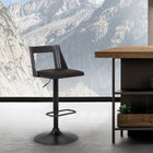 Armen Living Milan Adjustable Height Swivel Bar Stool in Black Faux Leather & Black Wood with Black Base-Mixing materials, colours and textures elevates a space’s style and creates a fresh effect. This stool features wood, metal, and beautiful faux leather upholstery.