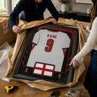 Frameworth Official FIFA World Cup 2026 England Harry Kane Framed Replica Jersey - 25.75" x 33.75"-Handcrafted in Canada by Frameworth Sports Marketing, established 1992, producing officially licensed sports memorabilia.