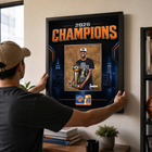 Frameworth New York Knicks 2026 Champions: OG Anunoby Trophy PhotoGlass Framed Photo - 18" W x 22" H - Black-Finished size 18x22 inches: Vertical framed display sized for living rooms, offices, fan caves, and sports rooms