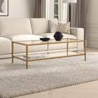Hudson&Canal Hera 54"W Rectangular Coffee Table with Glass Shelf - Antique Brass-Handcrafted finish applied to a steel frame