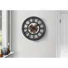 Monarch Specialties Clocks 20" Round Wall Clock - Black -A strong and durable black plastic frame with a glass surface and bronze metal moving gears against a white printed backdrop, brings a modern, industrial element