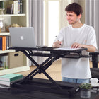 IMHome Sit Stand Desk Riser Standing Desk Converter with Keyboard Tray - 33" - Black-Built with a solid metal X-lift frame and durable MDF desktop surfaces, this desk riser offers dependable stability while supporting up to 40 lbs (18kg) of equipment. The non-slip base studs keep the riser securely in place on your desk while preventing unwanted movement during height adjustments