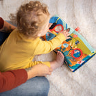 Manhattan Toy Bugging Through Sensory Book-Each page features a round cut-out for weaving tethered bug through