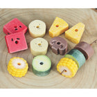 Yellow Door Sensory Play Stones Threading Kebabs 12-Piece Set-Each tactile set includes twelve stones, two each of the following: banana, zucchini, mushroom, pineapple, sweetcorn and watermelon.