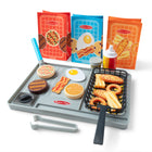 Melissa & Doug Flip Fry Grill Play Set-Colour-changing play food (chicken tenders, onion rings, fries, 2-piece bun with ketchup and mustard, burger, veggie burger, pancake) is white when dry, changes to brightly colored when “cooked” with water from spatula, squeeze bottle, shaker, or fryer