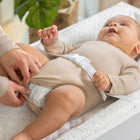 Ingenuity Summer Contoured Changing Pad-Added Security: The two high, curved sides and quick-release safety belt keep baby comfortably and securely on the changing table pad. An additional security strap underneath the changing pad keeps it attached to its surface, with a non-skid bottom for added safety
