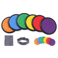 Kore Design Sensory Game Tiles - Assorted Colors - Two Sizes 10.23" & 4" - Classic Colors - Set of 14-Sensory game tiles set: Comes with 6 large discs, 6 small discs, blindfold and small bag for the small discs. The vibrant colors raised designs make them well-suited for children to engage in exploration and embrace external stimuli