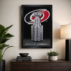 Frameworth Carolina Hurricanes 20" H x 29" W Framed Canvas 2026 Stanley Cup Champions Framed Canvas Wall Art 22.5x31.5 Frameworth - Licensed-Professionally framed in Canada: The image is printed on high-quality art canvas, professionally stretched, and presented in a premium black frame
