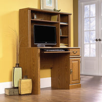 Sauder Orchard Hills Computer Desk with Hutch, Carolina Oak-The Orchard Hills Computer Desk with Hutch has a slide-out keyboard/mouse shelf with metal runners and safety stops and a spacious drawer that features the patented T-lock assembly system