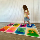 Kore Design Liquid Floor Tiles - Assorted Colors - Squares - 12" x 12" x 0.2" - Set of 9-Engage in a variety of activities: With these liquid-filled sensory tiles—hopscotch, jump, step, lay, dance, run, and even roll over them. Squish the "lava" inside the tiles and observe the captivating motion. These tiles offer numerous enjoyable ways to promote creative and sensory play