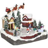 HOMCOM Animated Plug-In Lit Christmas Village with Santa and Deer-Features two houses, Christmas trees, a Santa Claus, a reindeer, a sled, a snowman, and children skating 