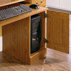 Sauder Orchard Hills Computer Desk with Hutch, Carolina Oak-The storage area behind this computer desk’s raised panel door holds a vertical CPU tower