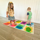 Kore Design Liquid Floor Tiles - Assorted Colors - Squares - 12" x 12" x 0.2" - Set of 9-Ideal for home and classroom settings: These floor activity mat tiles are hassle-free, requiring no installation. Perfect for nursery settings to teach colors or for teachers to guide kids to specific spots, it can also be utilized for interactive games or simply having fun with friends. The vibrant and attractive colors effortlessly capture the attention of little ones, serving as visual stimuli to help them identify d