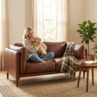 HOMCOM 59" PU Leather Loveseat Sofa with Wide Seat - Brown-Armrests with soft padded cushions create a cosy nook for optimal relaxation  