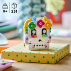 LEGO Seasons and Occasions Altar of the Dead-2 sides – One side of the model features a skull that’s decorated with LEGO flowers, while the other features an altar with a flower arch and various food accessories