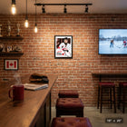 Frameworth Macklin Celebrini Replica Signature Collage Hockey Canada 2026 - Framed Print - 16" x 20"-Professional collage design showcasing multiple action photos with replica signature overlay. Black wood composite frame with real glass front protection