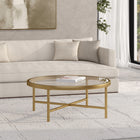 Hudson&Canal Xivil 36"W Round Coffee Table with Glass Top - Brass-Tabletop has a weight capacity of 50 lbs
