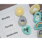 Yellow Door Weather Stones 10-Piece Set-Includes ten stones engraved and painted with the following representations: dark cloud, light cloud, hail, rain, rainbow, snow, sun, sunny intervals, thunderstorm, and wind.