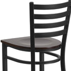 Flash Furniture HERCULES Series Black Ladder Back Metal Restaurant Barstool - Walnut Wood Seat-Two Curved Support Bars
