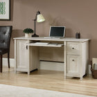 Sauder 59"W Edge Water Desk - Chalked Chestnut- Features of this small home office desk include:  Flip-down molding reveals slide-out keyboard/mouse shelf with metal runners and safety stops
