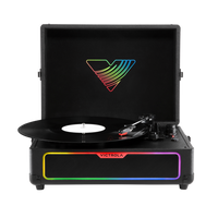 Victrola Journey Glow Illuminated Suitcase Record Player - Black-Create a light show with the integrated multicolour light ring, featuring 18 dynamic illumination modes to enhance your listening experience anywhere you take this portable record player