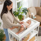 Ingenuity Summer Contoured Changing Pad-Easy To Clean: The durable, quilted double layer PEVA vinyl in this changing pad is made of waterproof material that can be easily wiped clean with a damp cloth for baby’s messy moments