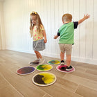 Kore Design Liquid Floor Tiles - Assorted Colors - Disc - 12" - Set of 9-Engage in a variety of activities: With these liquid-filled sensory tiles—hopscotch, jump, step, lay, dance, run, and even roll over them. Squish the "lava" inside the tiles and observe the captivating motion. These tiles offer numerous enjoyable ways to promote creative and sensory play