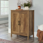 Sauder Storage Cabinet - Rural Pine-Adjustable shelving: Two adjustable shelves for the ultimate storage versatility. Each adjustable shelf has a maximum weight capacity of 25 lb