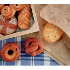 Yellow Door Sensory Play Stones - Breads of the World-The set contains eight foods: bagel, challah, croissant, fougasse, poppy seed bread, pretzel, saffron bun and sourdough.