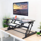 Mount-It! 36" Wide Standing Desk Converter with Gas Spring - Black-The gas spring mechanism allows for smooth & easy up and down height adjustments from 6.5" to 16.3"